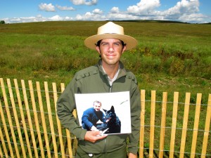 Brendan Wilson (holding a photo of Richard Guadagno) tells the stories of Flight 93 passengers' ties to nature in one of his interpretive talks